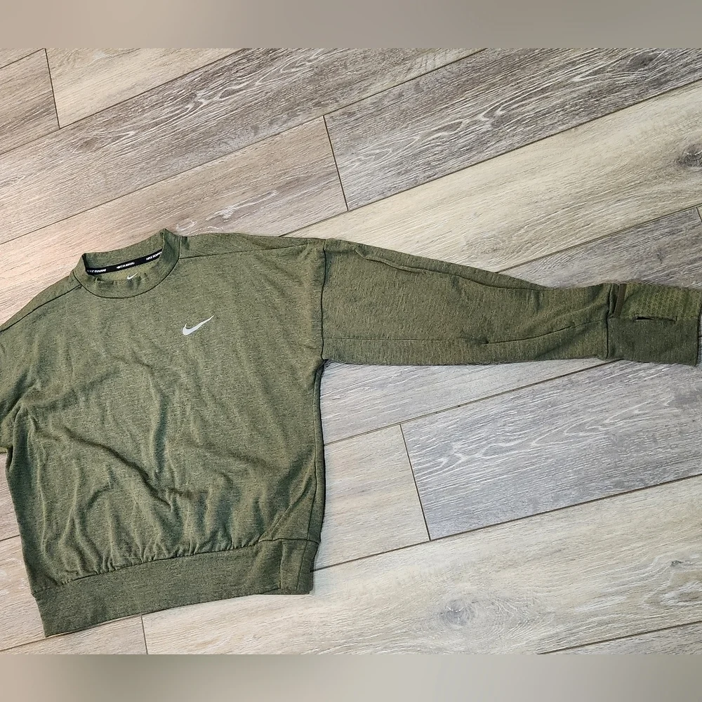 The Nike Running Women's Dri-Fit Crop Top Sweater in size Xsmall and olive green
